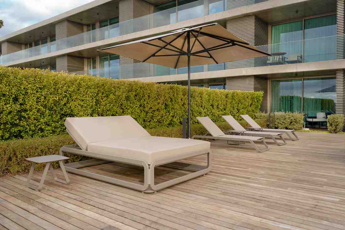 Sunbeds — private pool stone wall